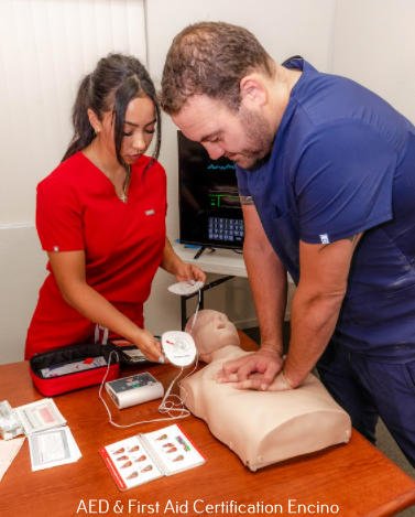 a male doctor and a female nurse emergency responders used automated external defibrillator to help a victim of heart attack with first aid certification in encino